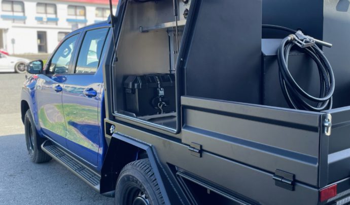 Custom Deck, with under body draw, Twin tool boxes with gull wing doors. Fitted with 12/240v power supply, custom diesel tank, interior and deck lights, wash down pump kit finished in a Raptor Black.